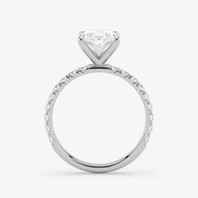 Diamond ring with a heart-shaped center stone on a white background