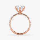 Rose gold ring with a diamond on a white background