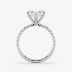 Diamond ring with a white gemstone on a light gray background