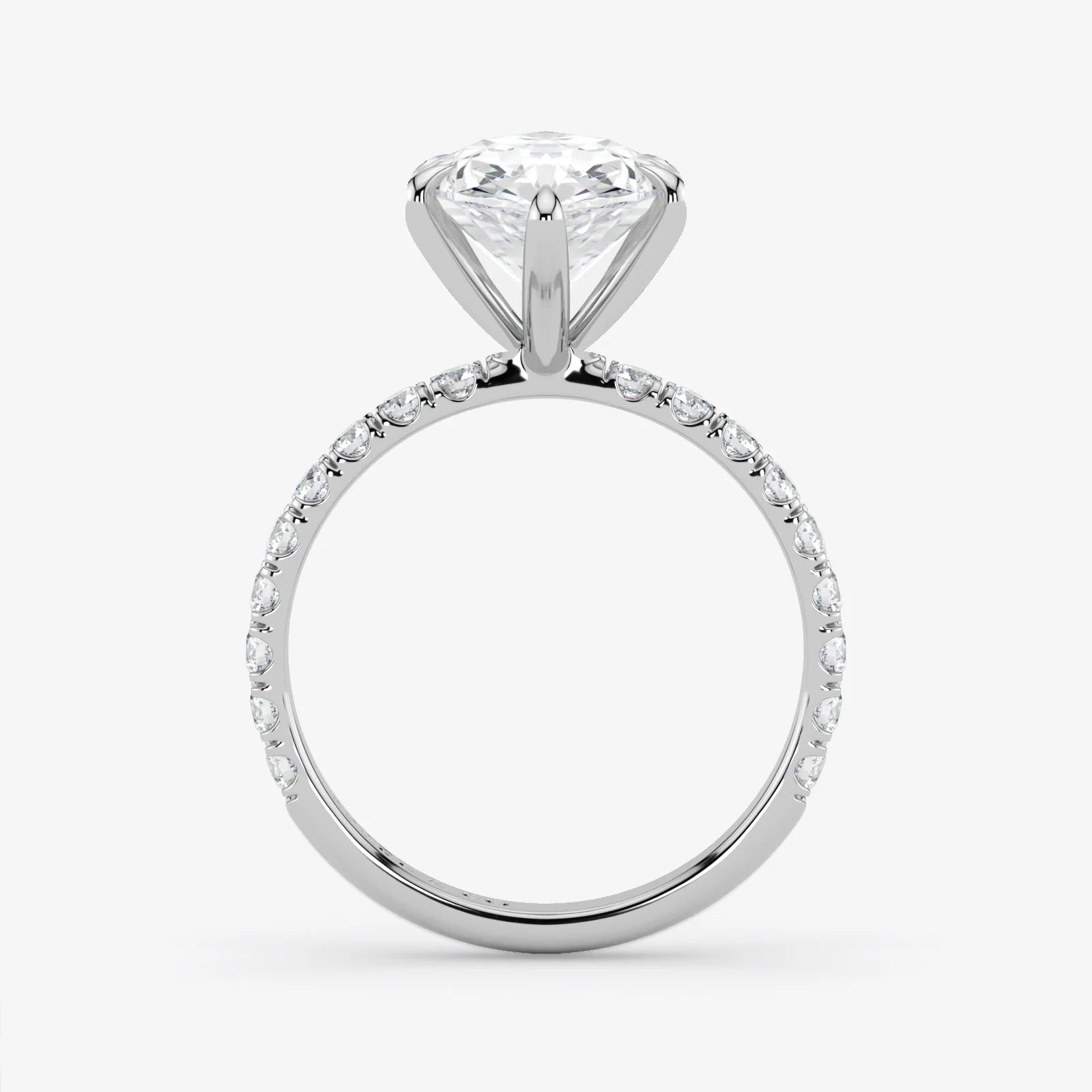 Diamond ring with a white gemstone on a light gray background
