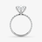 Diamond ring with a white gemstone on a light gray background
