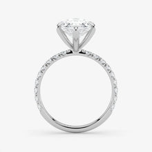 Diamond ring with a white gemstone on a light gray background