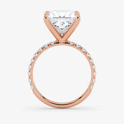 Rose gold ring with a diamond on a white background