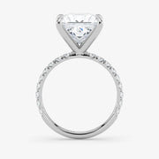 Diamond ring with a heart-shaped center stone on a white background