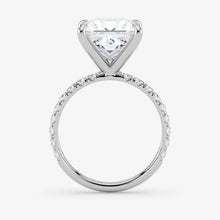 Diamond ring with a heart-shaped center stone on a white background
