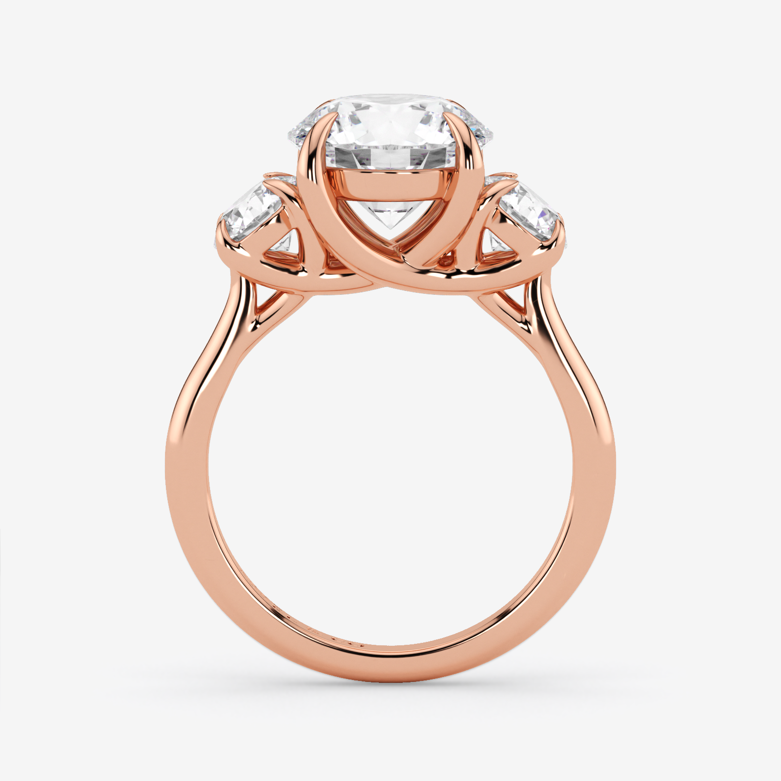 Rose gold ring with a central diamond and smaller diamonds on a white background