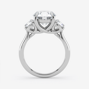 Silver ring with a central diamond and two smaller diamonds on a white background