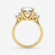Gold ring with a diamond on a white background
