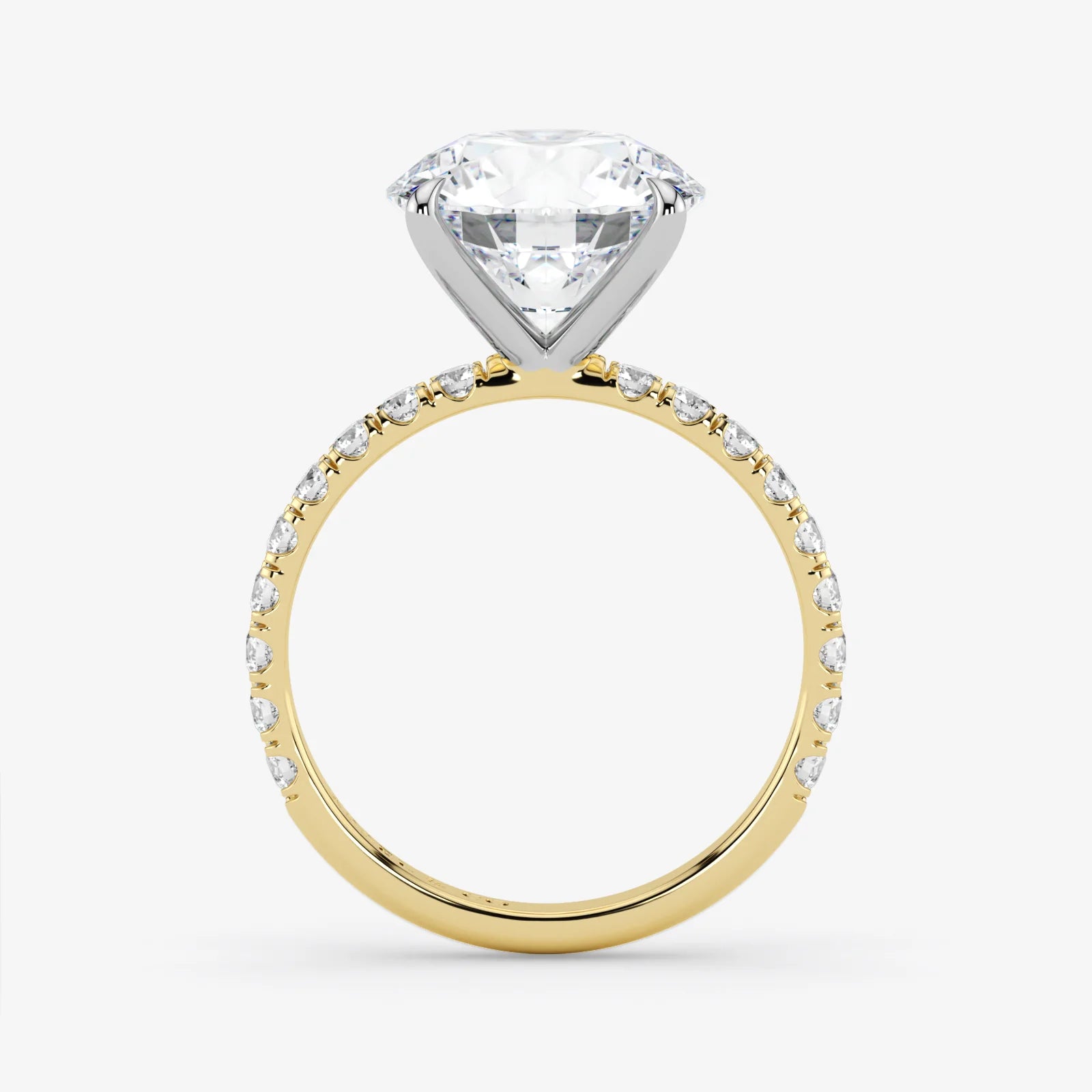 Gold ring with a large diamond and smaller diamonds on the band against a white background