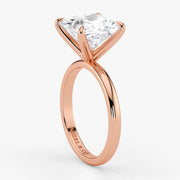 Close-up of princess cut lab diamond set in warm rose gold band