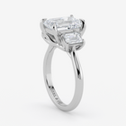 Diamond ring with two rectangular diamonds on a white background