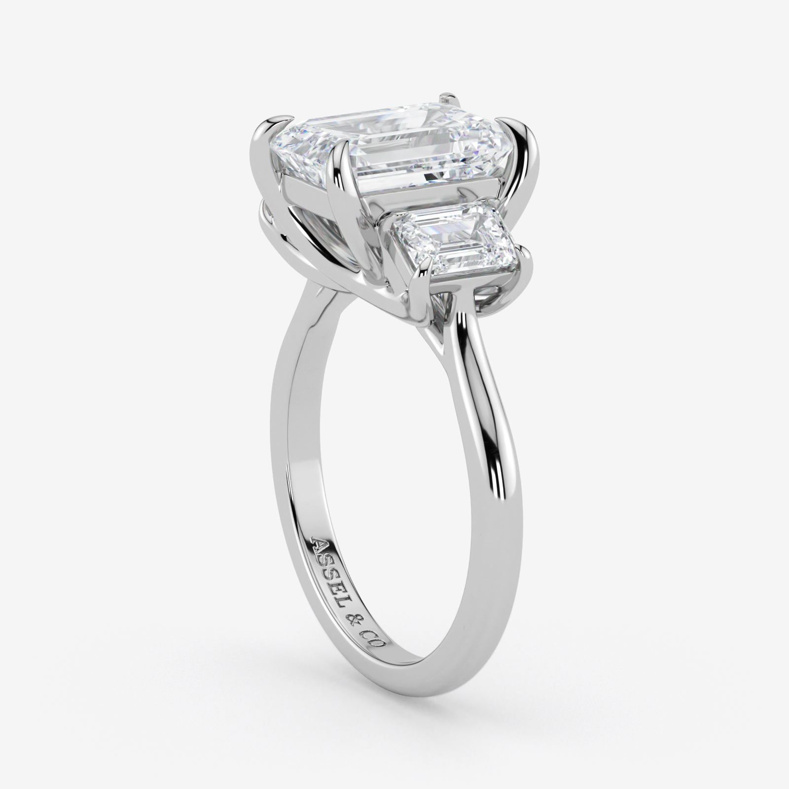 Diamond ring with two rectangular diamonds on a white background