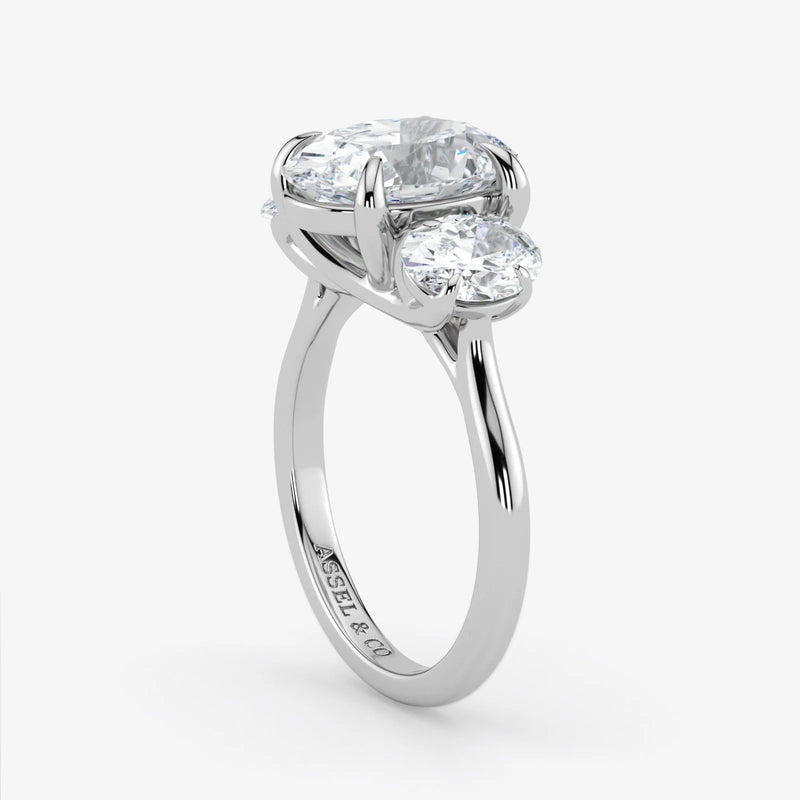 Silver ring with two diamonds on a white background