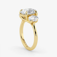 Gold ring with two diamonds on a white background