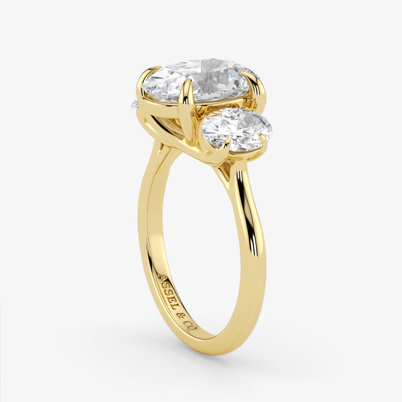 Gold ring with two diamonds on a white background