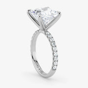 Diamond ring with a triangular stone and smaller diamonds on a white background