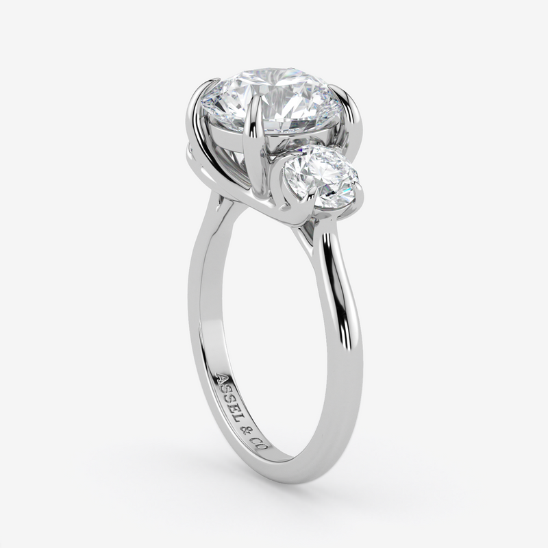 Silver ring with two diamonds on a white background