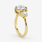 Gold ring with two diamonds on a white background