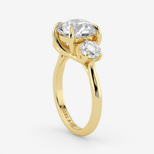 Gold ring with two diamonds on a white background