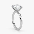 Close-up view of cushion cut lab-grown diamond in polished 18K white gold