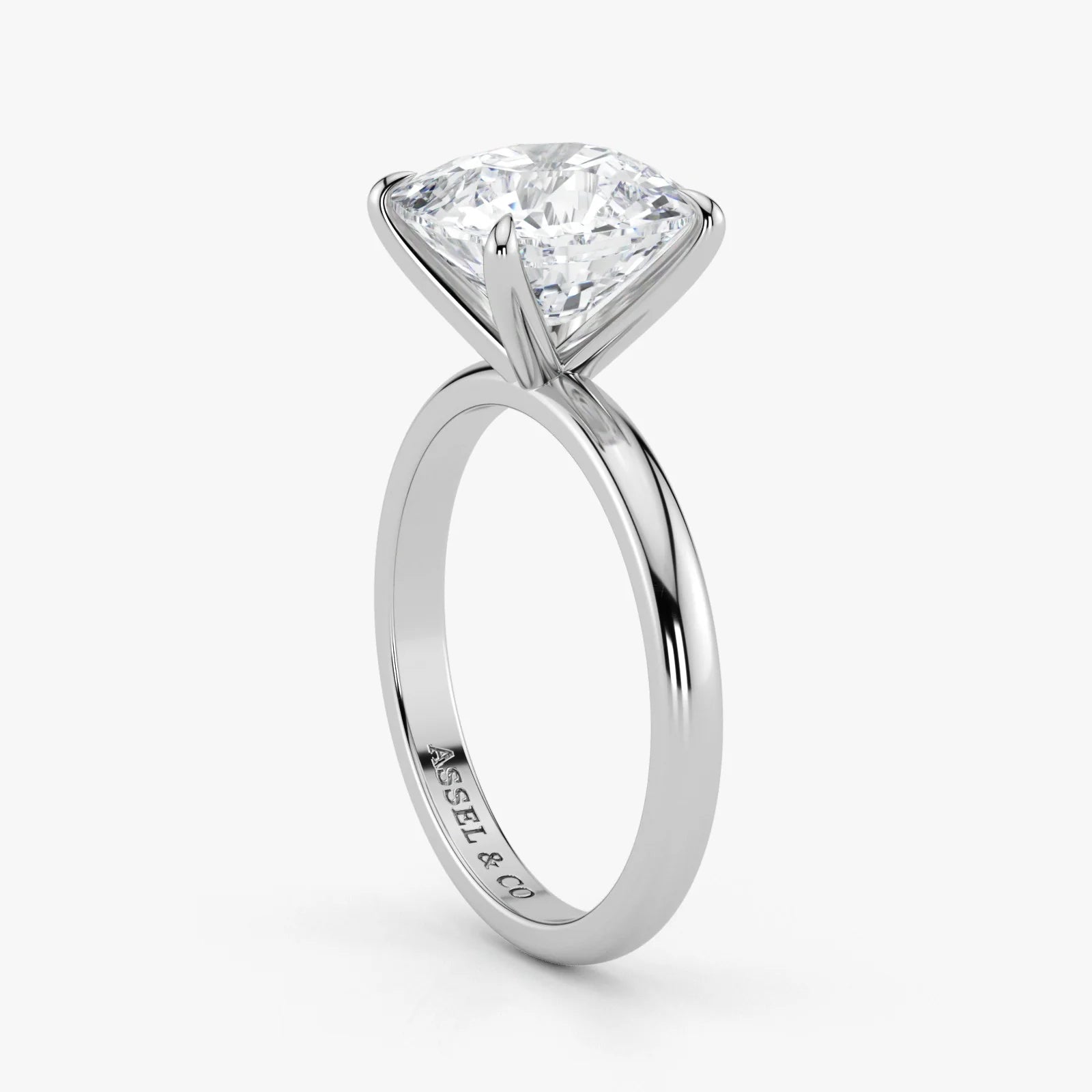 Close-up view of cushion cut lab-grown diamond in polished 18K white gold