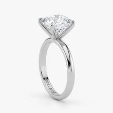Close-up view of cushion cut lab-grown diamond in polished 18K white gold