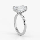 Close-up view of emerald cut lab-grown diamond set in polished 18K white gold