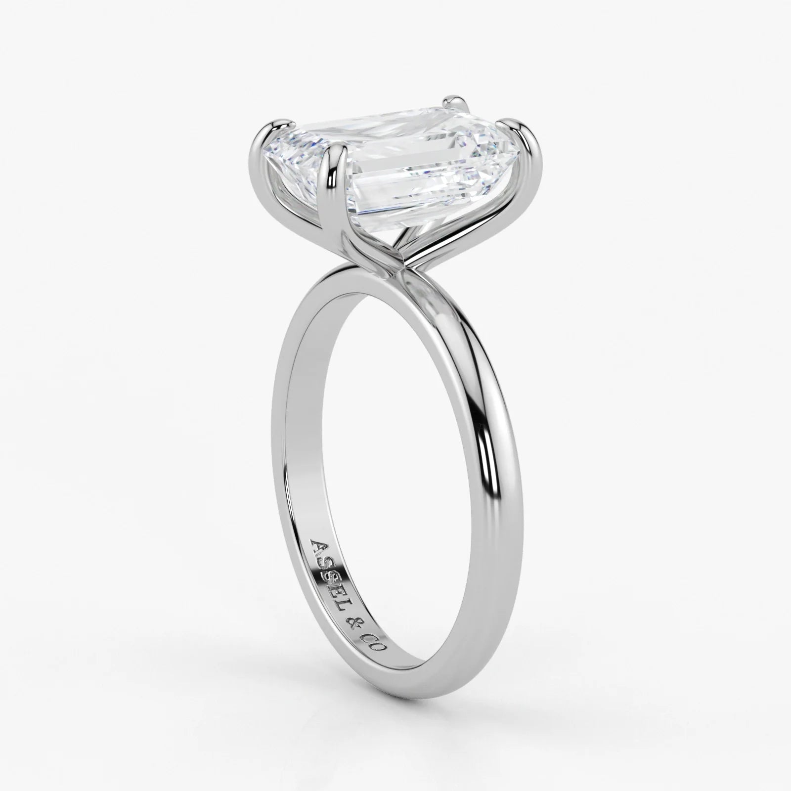 Close-up view of emerald cut lab-grown diamond set in polished 18K white gold