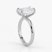 Close-up view of emerald cut lab-grown diamond set in polished 18K white gold