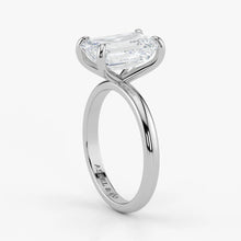 Close-up view of emerald cut lab-grown diamond set in polished 18K white gold