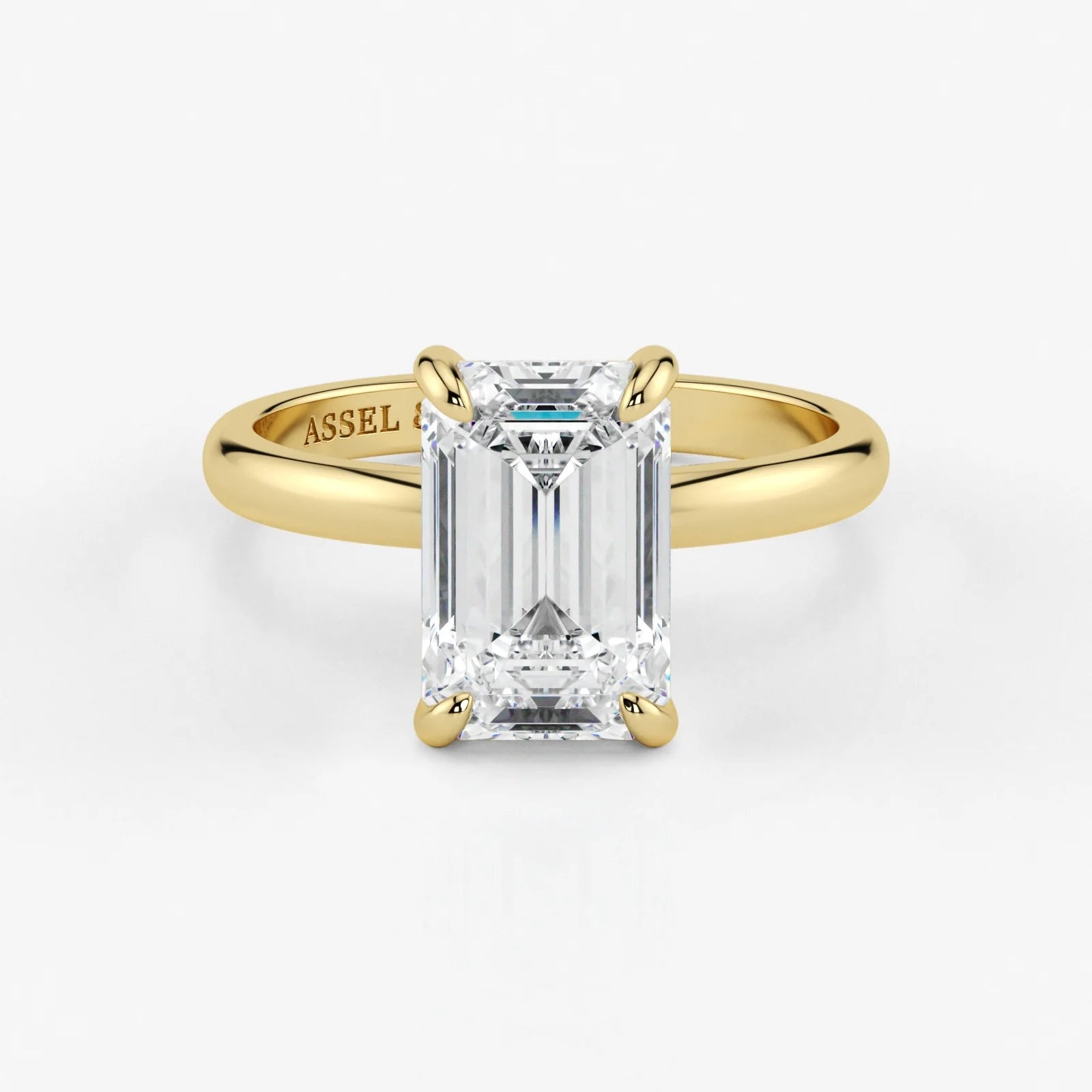Emerald cut lab-grown diamond engagement ring in 18K yellow gold by Assel & Co
