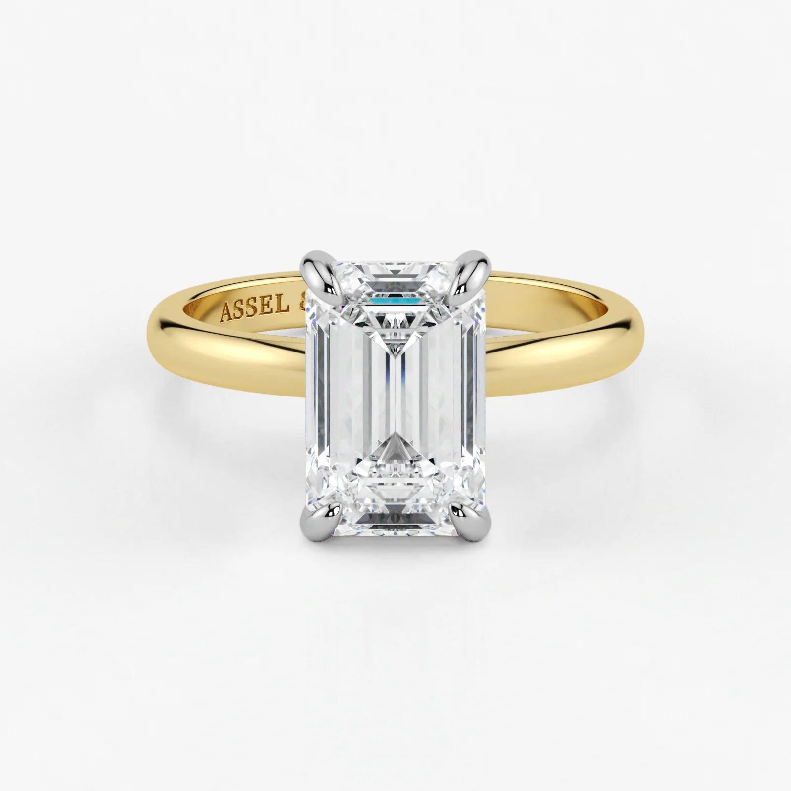 Emerald cut lab-grown diamond engagement ring in yellow and white 18K gold by Assel & Co
