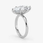 Hidden Halo emerald cut lab-grown diamond engagement ring in 18K White Gold angle