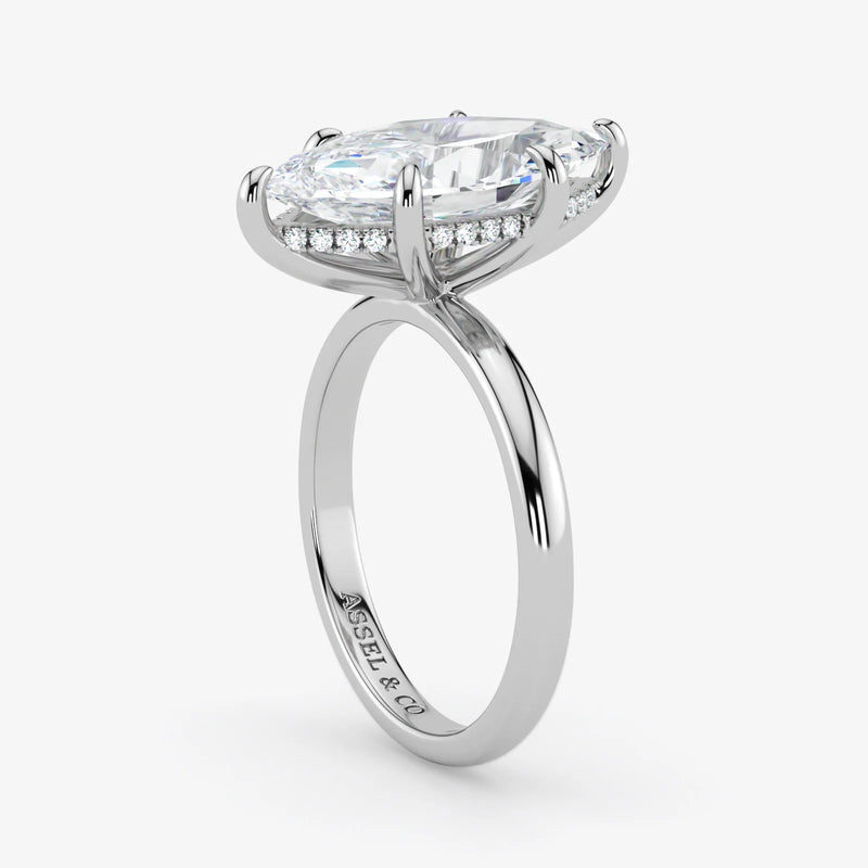 Hidden Halo emerald cut lab-grown diamond engagement ring in 18K White Gold angle