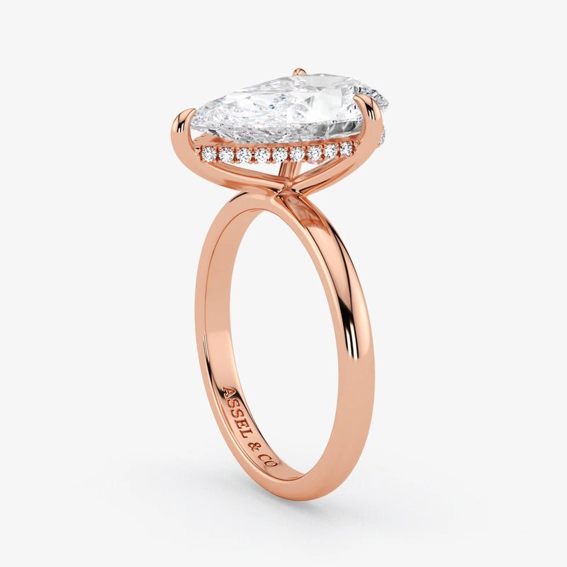 Hidden Halo pear cut lab-grown diamond engagement ring in 18K Rose Gold