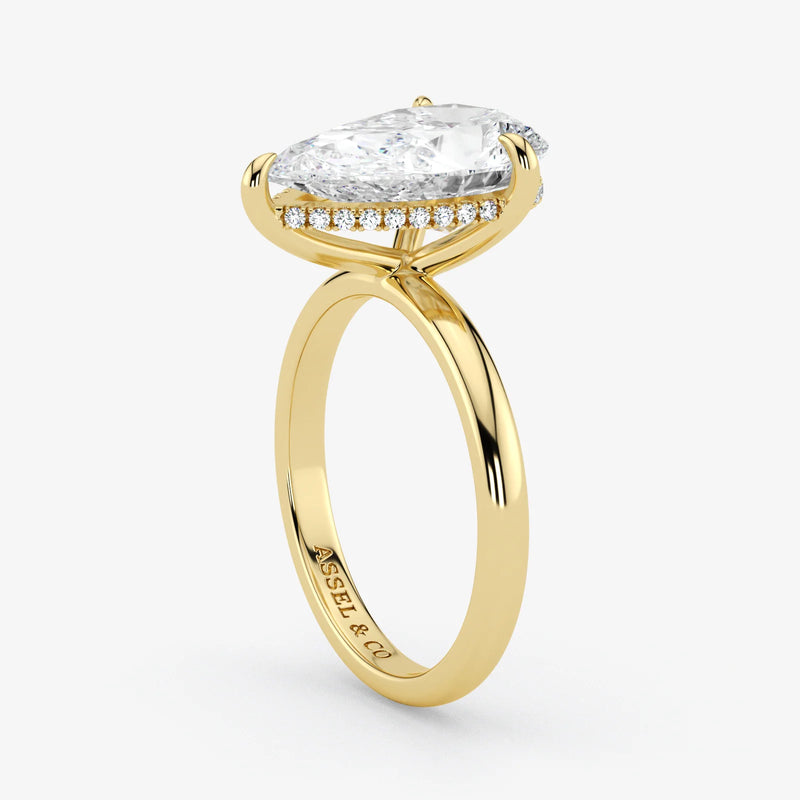 Hidden Halo pear cut lab-grown diamond engagement ring in 18K Yellow Gold