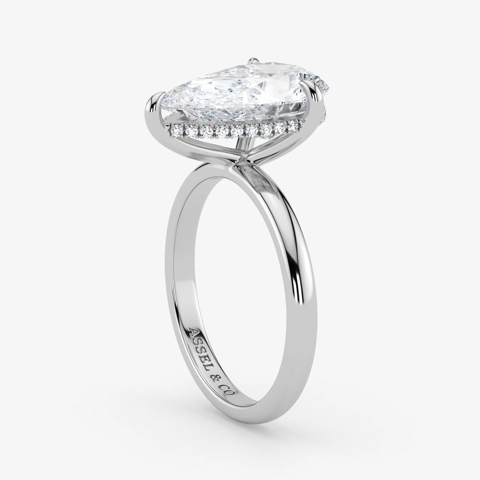 Hidden Halo pear cut lab-grown diamond engagement ring in Platinum