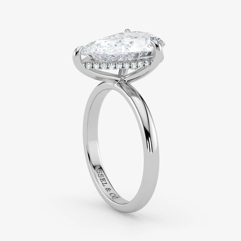 Hidden Halo pear cut lab-grown diamond engagement ring in Platinum