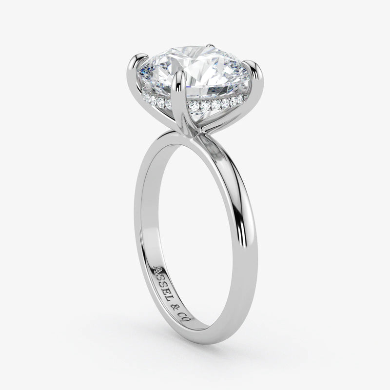 Hidden Halo round cut lab-grown diamond engagement ring in 18K White Gold