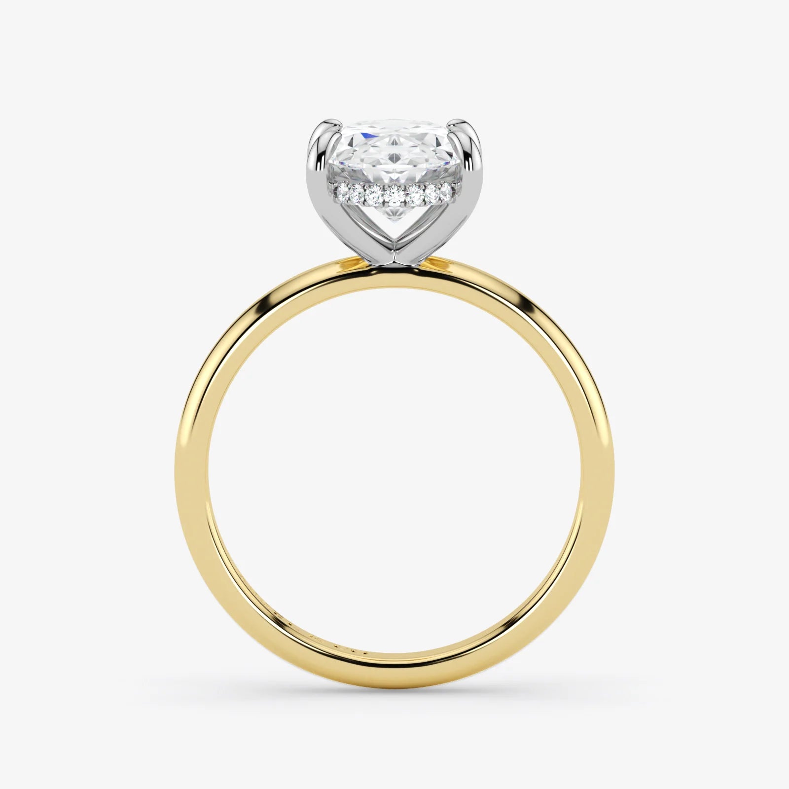 Two-tone gold and diamond ring on a white background