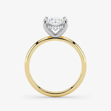 Two-tone gold and diamond ring on a white background