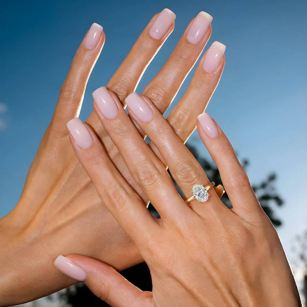  Oval Cut Diamond Ring on Hand – 18K Yellow Gold | Assel & Co