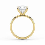 Side view of cushion cut lab-grown diamond ring in yellow gold setting