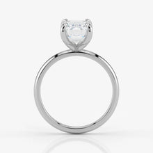 Side profile of emerald cut lab-grown diamond ring in sleek 18K white gold