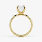 Side profile of emerald cut lab-grown diamond ring in warm 18K yellow gold