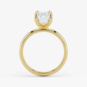 Side profile of emerald cut lab-grown diamond ring in warm 18K yellow gold